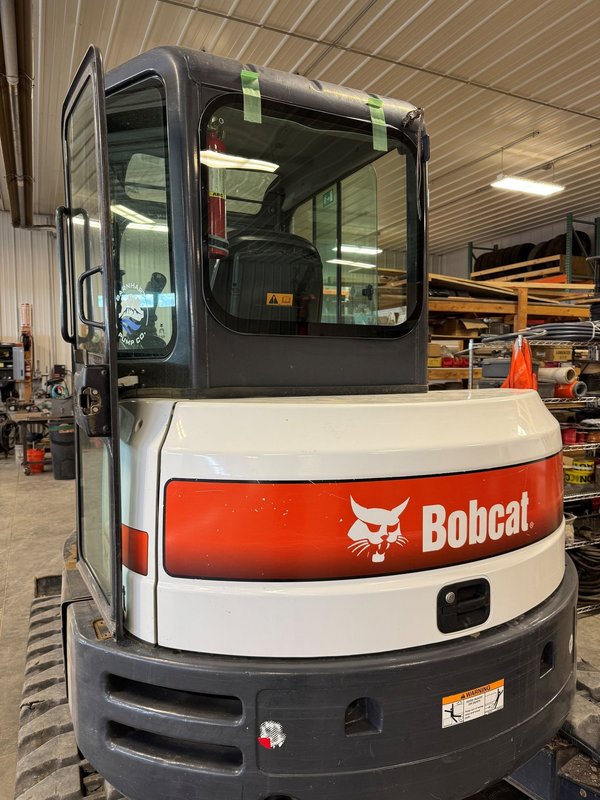 Bobcat excavator after cab door glass replacement by Shattered Vision Auto Glass in Colorado Springs