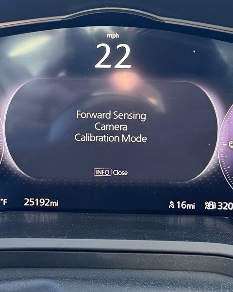 Dashboard cluster reading Forward Sensing Camera Calibration Mode during an ADAS calibration in Colorado Springs