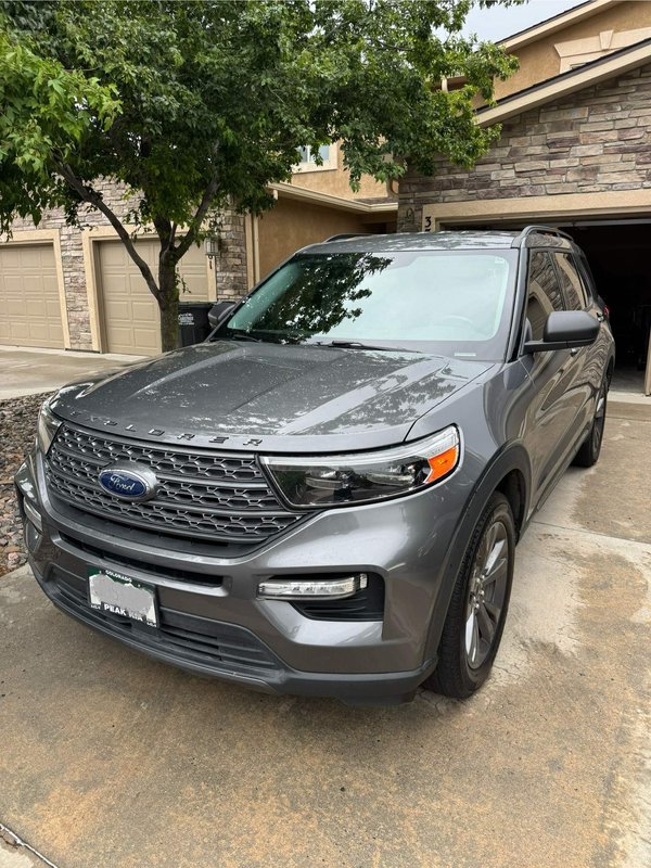 Gray SUV in a Colorado Springs driveway after mobile windshield replacement by Shattered Vision Auto Glass