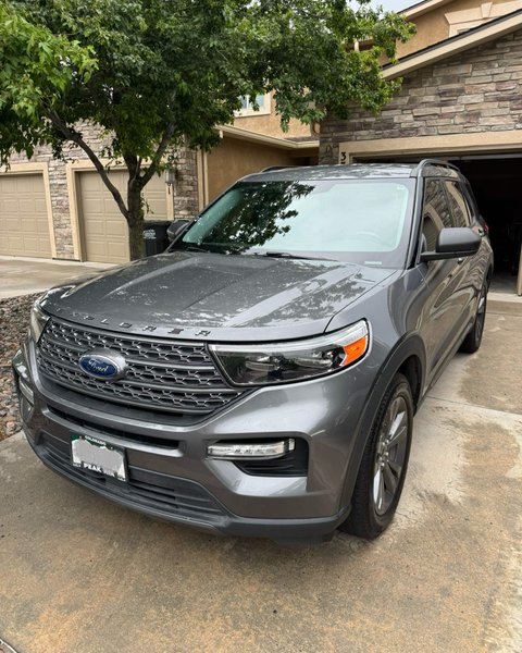 Gray SUV in a Colorado Springs driveway after mobile windshield replacement by Shattered Vision Auto Glass