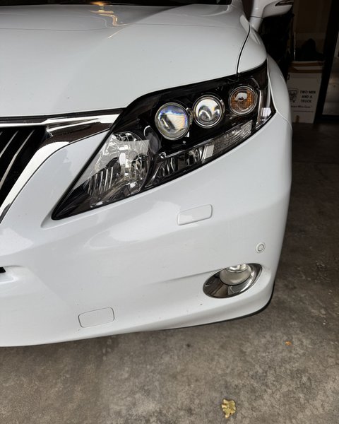 Clear restored headlight on a white SUV in Colorado Springs