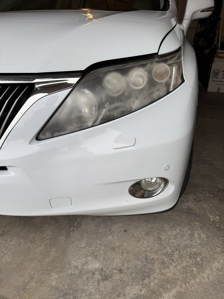 Before: hazy, yellowed headlight on an SUV in Colorado Springs
