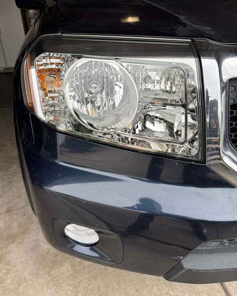 Restored headlight on a dark SUV in Colorado Springs