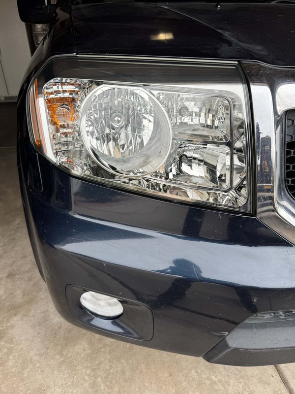 Restored headlight on a dark SUV in Colorado Springs