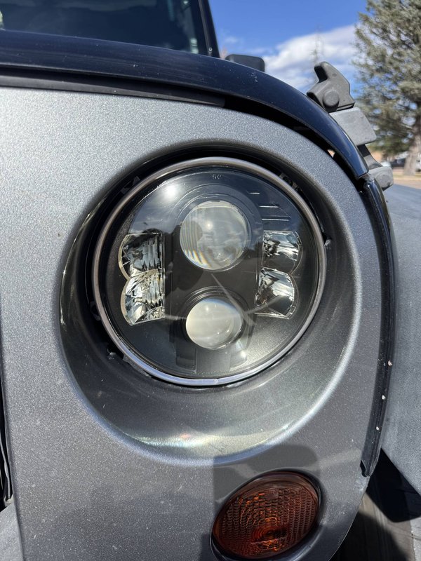 Restored projector headlight on a silver vehicle in Colorado Springs
