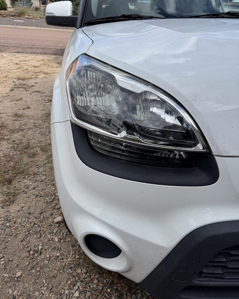 Headlight restoration on a white crossover in Colorado Springs