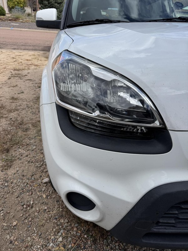 Headlight restoration on a white crossover in Colorado Springs