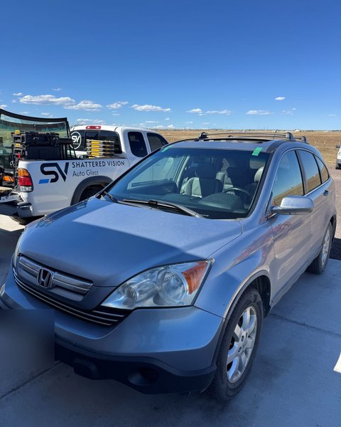 Honda CR-V beside the Shattered Vision service truck after mobile windshield replacement in Colorado Springs