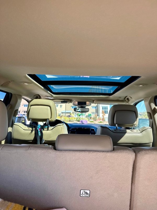 Interior view of a newly installed panoramic sunroof in a Colorado Springs SUV