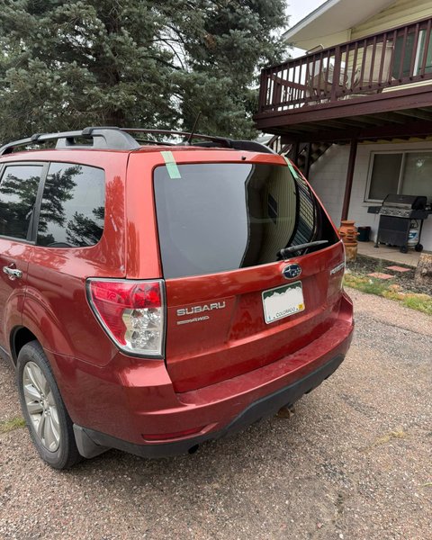 Maroon Subaru after rear back glass replacement in Colorado Springs