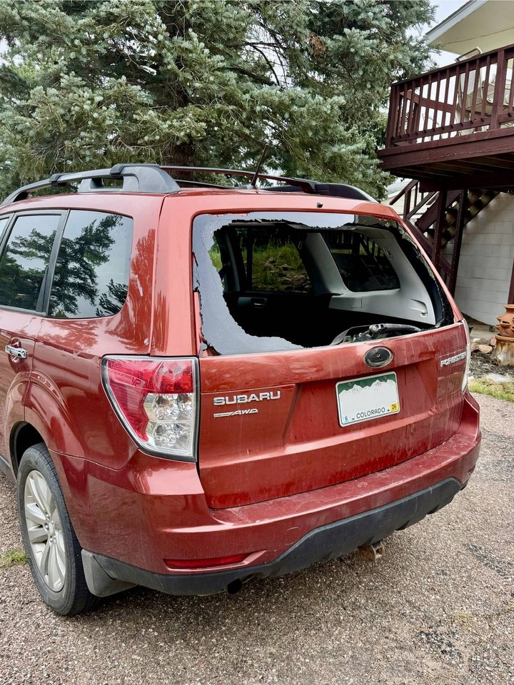 Before: maroon Subaru Forester with shattered rear back glass, Colorado Springs