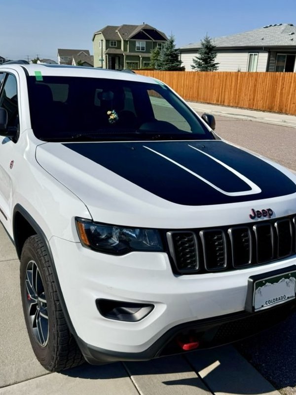 White Jeep Grand Cherokee after windshield replacement in Colorado Springs