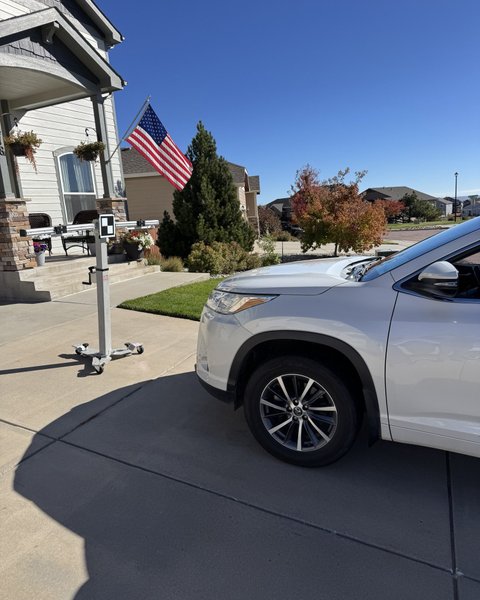 White SUV at a Colorado Springs home during a mobile Shattered Vision Auto Glass service call