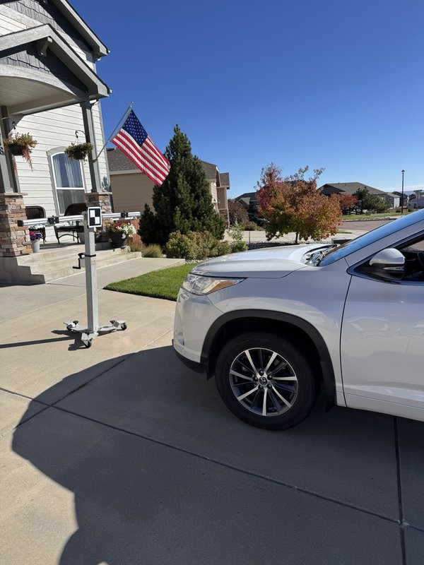 White SUV at a Colorado Springs home during a mobile Shattered Vision Auto Glass service call